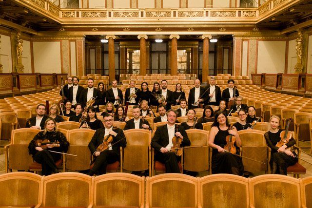 Metropolitan Kammerorchester Wien musicians with their instruments in a Viennese concert hall